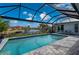 Inviting screened pool with canal views and spacious patio at 1380 Willet Ct, Punta Gorda, FL 33950