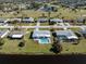 Aerial view of home with pool and golf course at 143 Rotonda Cir, Rotonda West, FL 33947