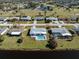 Aerial view of single-Gathering home with pool, situated on canal at 143 Rotonda Cir, Rotonda West, FL 33947