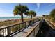 Wooden walkway leading to the beach at 143 Rotonda Cir, Rotonda West, FL 33947