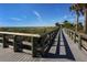 Wooden boardwalk leads to beach access at 143 Rotonda Cir, Rotonda West, FL 33947