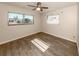 Bright bedroom with hardwood floors and two windows at 143 Rotonda Cir, Rotonda West, FL 33947