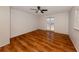 Bright bedroom showcasing wood-look flooring and French doors at 143 Rotonda Cir, Rotonda West, FL 33947