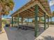 Covered picnic area with tables and benches at 143 Rotonda Cir, Rotonda West, FL 33947