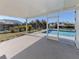 Relaxing pool area with screened enclosure and view of the canal at 143 Rotonda Cir, Rotonda West, FL 33947