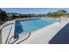 Refreshing pool with a spacious deck and surrounding greenery at 143 Rotonda Cir, Rotonda West, FL 33947