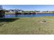 View of waterfront property with canal and distant home at 143 Rotonda Cir, Rotonda West, FL 33947