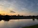 Peaceful waterfront view at sunset at 143 Rotonda Cir, Rotonda West, FL 33947