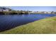 Scenic waterfront view featuring a canal and lush green grass at 143 Rotonda Cir, Rotonda West, FL 33947