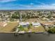 Aerial view showing home, pool, and canal access at 160 Salem Nw Ave, Port Charlotte, FL 33952