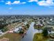 Aerial view of canal-front home with private pool and dock at 160 Salem Nw Ave, Port Charlotte, FL 33952