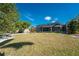 Large grassy backyard with screened enclosure at 160 Salem Nw Ave, Port Charlotte, FL 33952