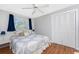 Comfortable bedroom featuring a queen bed, built in closet and ceiling fan at 160 Salem Nw Ave, Port Charlotte, FL 33952