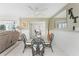 Bright dining room with glass top table and four black wicker chairs at 160 Salem Nw Ave, Port Charlotte, FL 33952