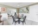 Dining area with glass table, wicker chairs, and view into another room at 160 Salem Nw Ave, Port Charlotte, FL 33952