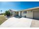 House entrance with light-colored siding and paved driveway at 160 Salem Nw Ave, Port Charlotte, FL 33952