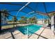 Relaxing screened pool with paved patio at 160 Salem Nw Ave, Port Charlotte, FL 33952