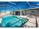 Enjoy this screened pool and patio oasis at 160 Salem Nw Ave, Port Charlotte, FL 33952