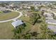 Aerial view of a residential area showing houses and green spaces at 16305 Branco Dr, Punta Gorda, FL 33955