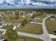 Aerial view showcasing the neighborhood's layout, homes and surrounding landscape at 16305 Branco Dr, Punta Gorda, FL 33955