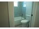 Clean bathroom with shower/tub and tile surround at 16305 Branco Dr, Punta Gorda, FL 33955