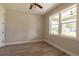 Bright bedroom with wood-look floors and large window at 16305 Branco Dr, Punta Gorda, FL 33955