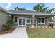 Front entrance with double doors and a walkway leading to the house at 16305 Branco Dr, Punta Gorda, FL 33955