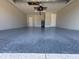 Spacious two-car garage with epoxy flooring and ample storage at 16305 Branco Dr, Punta Gorda, FL 33955