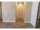 Light and bright hallway with vinyl plank flooring at 16305 Branco Dr, Punta Gorda, FL 33955