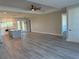 Spacious living room features light gray vinyl plank flooring and high ceilings at 16305 Branco Dr, Punta Gorda, FL 33955