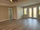 Spacious living room with vinyl plank flooring, high ceilings and access to the backyard at 16305 Branco Dr, Punta Gorda, FL 33955