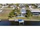 Aerial view showcasing home, pool, dock and canal at 18170 Avonsdale Cir, Port Charlotte, FL 33948