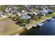 Aerial view of canal-front home with private dock and boat lift at 18170 Avonsdale Cir, Port Charlotte, FL 33948