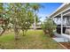 Landscaped backyard with lush greenery and canal views at 18170 Avonsdale Cir, Port Charlotte, FL 33948