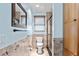 Light blue bathroom with a shower/tub combo and updated fixtures at 18170 Avonsdale Cir, Port Charlotte, FL 33948