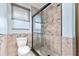 Bathroom features a large tiled shower and toilet at 18170 Avonsdale Cir, Port Charlotte, FL 33948