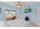 Bright bedroom with water view, ceiling fan, and nautical bedding at 18170 Avonsdale Cir, Port Charlotte, FL 33948