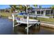 Private boat lift on canal-front property at 18170 Avonsdale Cir, Port Charlotte, FL 33948