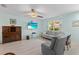 Relaxing living room with light walls, gray couches, and a large TV at 18170 Avonsdale Cir, Port Charlotte, FL 33948