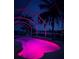 Inviting pool with pink lighting at night at 18170 Avonsdale Cir, Port Charlotte, FL 33948