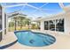 Inviting kidney-shaped pool with screened enclosure at 18170 Avonsdale Cir, Port Charlotte, FL 33948