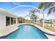 Sparkling pool with screened enclosure and water view at 18170 Avonsdale Cir, Port Charlotte, FL 33948