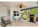 Screened porch with ceiling fan, grill, and seating at 18170 Avonsdale Cir, Port Charlotte, FL 33948