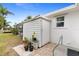 White storage shed with potted plants at 18170 Avonsdale Cir, Port Charlotte, FL 33948