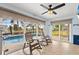 Bright sunroom with sliding doors and pool view at 18170 Avonsdale Cir, Port Charlotte, FL 33948