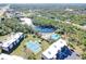 Bird's-eye view of condo complex with tennis courts and swimming pool at 1999 Kings Hwy # 23C, Punta Gorda, FL 33980