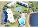 Resort-style condo community with lake, pool, and tennis court at 1999 Kings Hwy # 23C, Punta Gorda, FL 33980