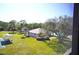 Community pool and clubhouse with lush landscaping at 1999 Kings Hwy # 23C, Punta Gorda, FL 33980