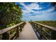 Wooden walkway leads to beach access at 1999 Kings Hwy # 23C, Punta Gorda, FL 33980