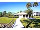 Community clubhouse with walkway and landscaping at 1999 Kings Hwy # 23C, Punta Gorda, FL 33980